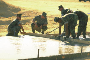 military engineers pouring a concrete slab